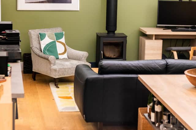 The wood-burning stove rarely ever used creates a focal point