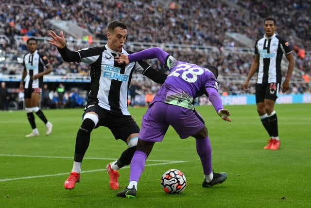 Tanguy Ndombele of Spurs is challenged by Javier Manquillo during the Premier League match between Newcastle United and Tottenham Hotspur at St. James Park on October 17, 2021 in Newcastle upon Tyne, England.