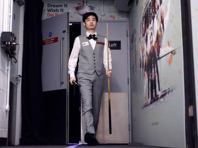 SHEFFIELD, ENGLAND - APRIL 27: Si Jiahui of China walks back to their dressing room during their Semi Final match against Luca Brecel of Belgium on Day Thirteen of the Cazoo World Snooker Championship 2023 at Crucible Theatre on April 27, 2023 in Sheffield, England. (Photo by George Wood/Getty Images)