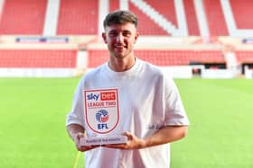 Swindon Town striker Jake Young - on loan from Bradford City - pictured with his Sky Bet League Two player-of-the-month award for August. Picture courtesy of the EFL.