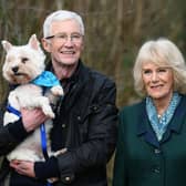 Paul O’Grady walking with the then Duchess of Cornwall, now Queen, during her visit to the Battersea Dogs and Cats Home centre in Brands Hatch, Kent in February 2022. Photo credit: Stuart Wilson/PA