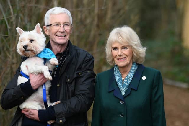 Paul O’Grady walking with the then Duchess of Cornwall, now Queen, during her visit to the Battersea Dogs and Cats Home centre in Brands Hatch, Kent in February 2022. Photo credit: Stuart Wilson/PA
