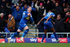Ronan Curtis equalised for AFC Wimbledon - and saw red. Image: Tom Dulat/Getty Images