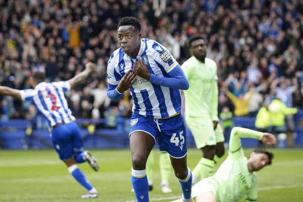 Full throttle: Anthony Musaba wheels away in celebration after giving Sheffield Wednesday the lead against West Brom in a huge game at Hillsborough (Picture: Steve Ellis)