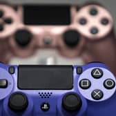 Wireless controller for the PlayStation 4 (PS4) game console are displayed in the Sony Interactive Entertainment Inc. booth on the business day of the Tokyo Game Show 2019.