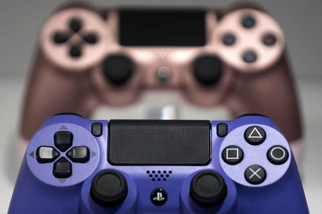 Wireless controller for the PlayStation 4 (PS4) game console are displayed in the Sony Interactive Entertainment Inc. booth on the business day of the Tokyo Game Show 2019.