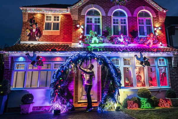 Michael Fenning puts the finish touches to his Wonka themed home in Doncaster. Photo credit: Danny Lawson/PA Wire