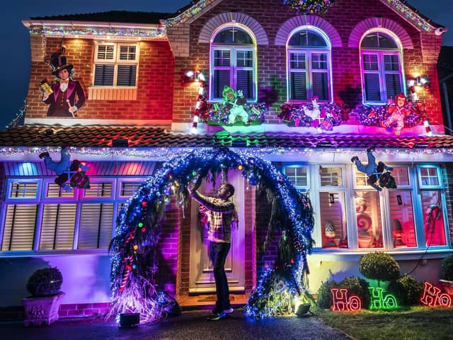 Michael Fenning puts the finish touches to his Wonka themed home in Doncaster. Photo credit: Danny Lawson/PA Wire
