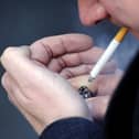 A man smoking a cigarette. PIC: PA
