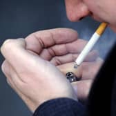 A man smoking a cigarette. PIC: PA