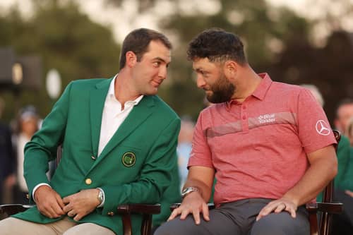 The odd couple: 2022 Masters champion Scottie Scheffler of the United States looks on with Jon Rahm of Spain during the Green Jacket Ceremony after Rahm won the 2023 tournament at Augusta National (Picture: Christian Petersen/Getty Images)