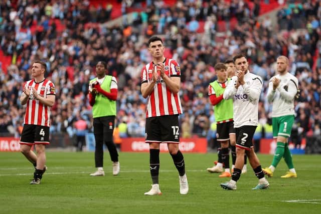 FANFARE: John Egan leads the Sheffield United applause for their travelling fans