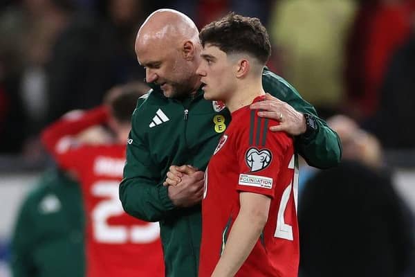 HEARTBREAK: Wales coach Rob Page consoles Dan James after the Leeds United winger missed his penalty in the shoot-out which decided their Euro 2024 play-off against Poland