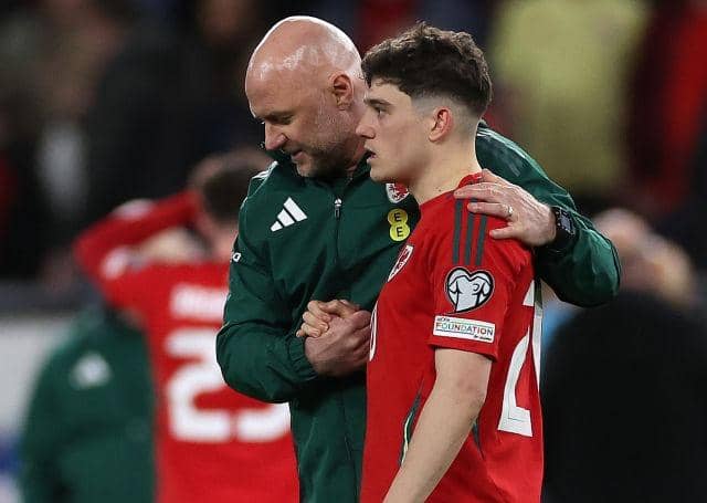 HEARTBREAK: Wales coach Rob Page consoles Dan James after the Leeds United winger missed his penalty in the shoot-out which decided their Euro 2024 play-off against Poland