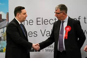 Tees Valley mayor Ben Houchen (L) shakes hands with Labour's Chris McEwan at the declaration at Thornaby Pavillion.