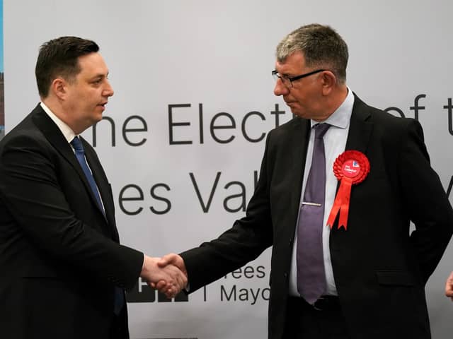 Tees Valley mayor Ben Houchen (L) shakes hands with Labour's Chris McEwan at the declaration at Thornaby Pavillion.