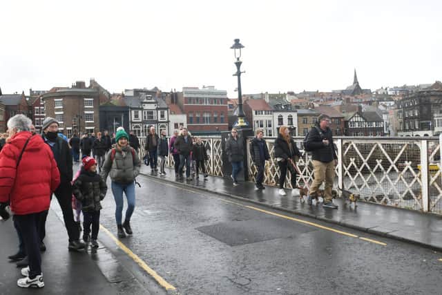 Pedestrians walking along Whitby Swing Bridge. PIC: Gary Longbottom