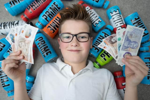 Charlie Smith, 10 of Nottingham who is selling his empty Prime bottles
SWNS