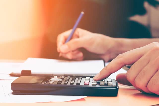 A photo of someone adding up their finances on a calculator. PIC: PA Photo/thinkstockphotos