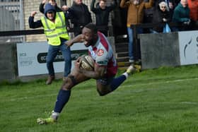 THE RACE IS ON: John Okafor celebrates scoring one of two tries for Rotherham Titans in their stunning 32-26 win over National League Two North promotion rivals Leeds Tykes at Clifton Lane. Picture: Kerrie Beddows.