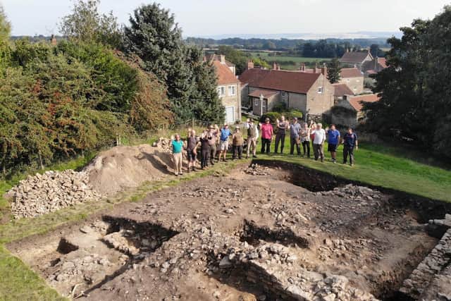 The archaeological team at Brompton Castle Hill in September 2021 with the remains of a medieval building.