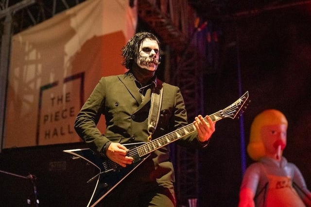 Wes Borland from Limp Bizkit donned face paint and played his guitar.