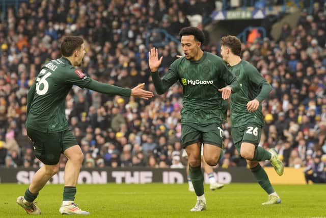 Millwall's Femi Azeez (centre) celebrates after scoring his sides second goal against Leeds (Picture: Danny Lawson/PA Wire)