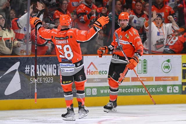ICE BREAKER: Scott Allen celebrates with new signing Dominic Cormier after putting Sheffield Steelers 4-1 ahead against Belfast Giants. Picture courtesy of Dean Woolley/Steelers Media