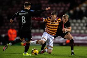 Doncaster Rovers defender Jay McGrath gets to grips with Bradford City striker Andy Cook - who was sent off late in the game on Tuesday night. Picture: Bruce Rollinson.