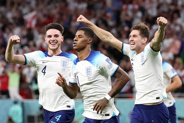 DOHA, QATAR - NOVEMBER 29: Marcus Rashford of England celebrates after scoring their team's first goal during the FIFA World Cup Qatar 2022 Group B match between Wales and England at Ahmad Bin Ali Stadium on November 29, 2022 in Doha, Qatar. (Photo by Francois Nel/Getty Images)