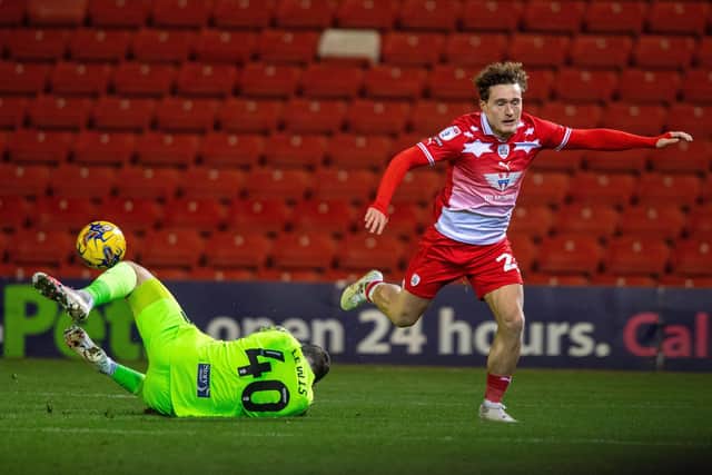 DENIED Harry Lewis stops Callum Styles having an effort on the Carlisle United goal