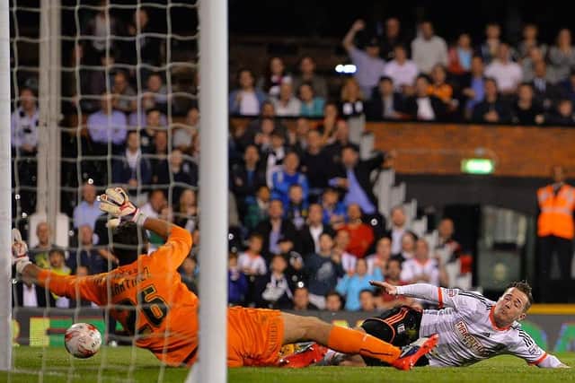 MERRY MILLER: Rotherham United loanee Emiliano Martinez saves from Fulham's Ross McCormack in 2015