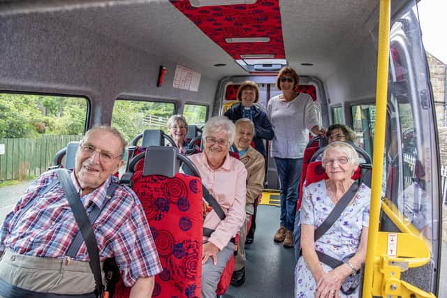 Passengers aboard with Sally Wilson and Liz Sheard (both standing)  who help run the The Heather Hopper community bus serving the Upper Esk valley including Danby & Castleton in the North York Moors