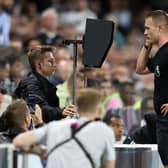 Referee Thomas Bramall checks the VAR screen during a Premier League fixture. Picture: Catherine Ivill/Getty Images.