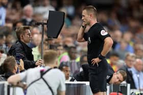 Referee Thomas Bramall checks the VAR screen during a Premier League fixture. Picture: Catherine Ivill/Getty Images.