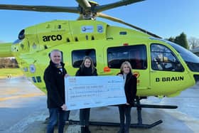 Mark and Carol presenting a cheque to the Yorkshire Air Ambulance