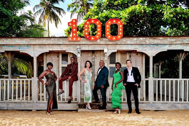 Death In Paradise. Pictured: Ginny Holder as Darlene, Tahj Miles as Marlon Pryce, Elizabeth Bourgine as Catherine Bordey, Don Warrington as Commissioner Selwyn Patterson, Shantol Jackson as Naomi Thomas and Ralf Little as DI Neville Parker. Credit: BBC / Red Planet Pictures / Denis Guyenon.