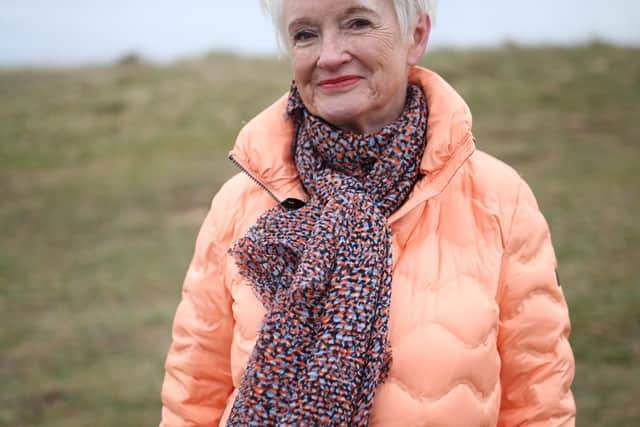 Annie Stirk wears a peach down-filled puffer coat by Danish brand Junge at Georgie’s Harrogate; a scarf from John Lewis, with Joules gilet and M&S Goodmove leggings under. Image: Cardiff Productions, Steve Kingston