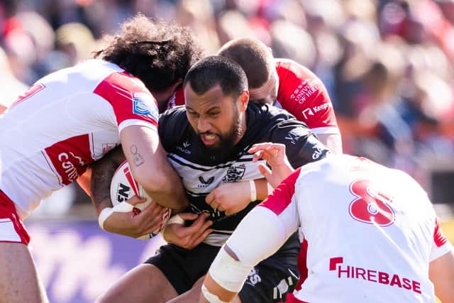 All wrapped up: Hull FC's Ligi Sao is tackled by Hull KR. (Picture: SWpix.com)