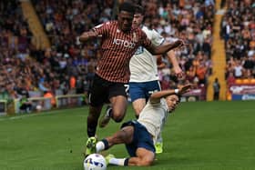 Bradford's Josh Neufville is brought down by Huddersfield's Ruben Roosken. (Picture: Jonathan Gawthorpe)