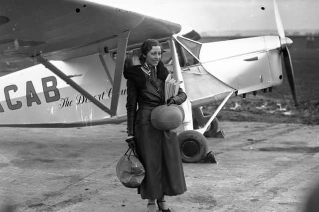 8th November 1932:  British aviation pioneer Amy Johnson (1903 - 1941) at Stag Lane aerodrome before leaving for Capetown in an attempt to break her husband's 17 hour record for the journey.  (Photo by Hudson/Topical Press Agency/Getty Images)