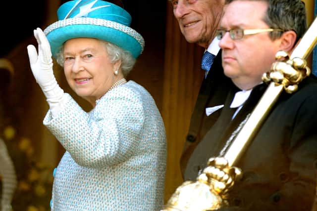 The Queen waving to the crowds from the steps outside the Mansion House  in York in 2012.