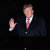 President Donald Trump waves to reporters. PIC: AP Photo/Jose Luis Magana