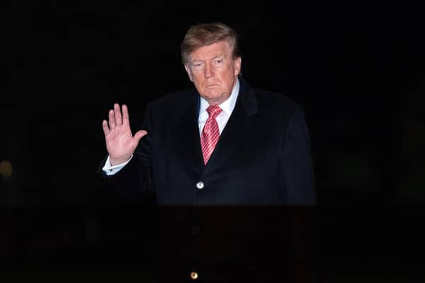 President Donald Trump waves to reporters. PIC: AP Photo/Jose Luis Magana