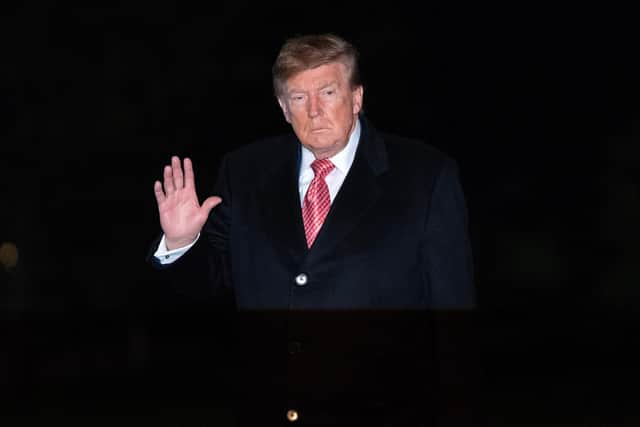President Donald Trump waves to reporters. PIC: AP Photo/Jose Luis Magana