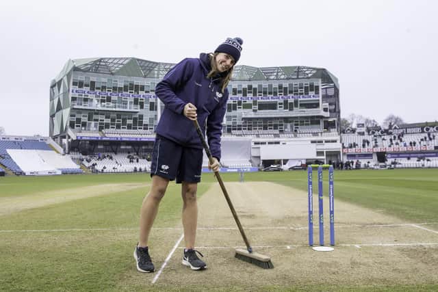 Jasmine Nicholls, who recently joined the groundstaff at Yorkshire County Cricket Club, prepares the surface before play in an LV County Championship match (Picture: Allan McKenzie/SWpix.com)