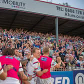 Wakefield celebrate the win over Wigan with the fans. (Photo: Olly Hassell/SWpix.com)