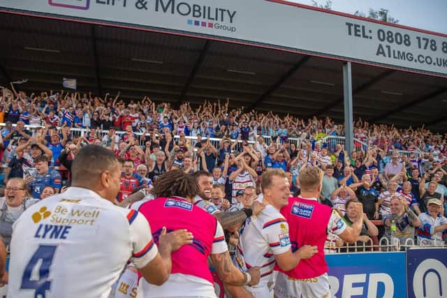 Wakefield celebrate the win over Wigan with the fans. (Photo: Olly Hassell/SWpix.com)
