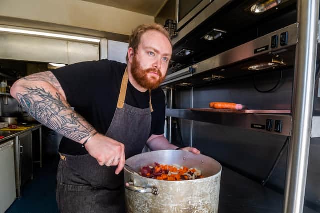 Head chef Matt Hind prepares vegetables and stock for the venison pie