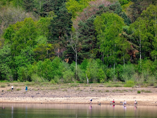 People enjoying the warm weather and cooling off in the water at Swinsty Reservoir. Picture: James Hardisty.